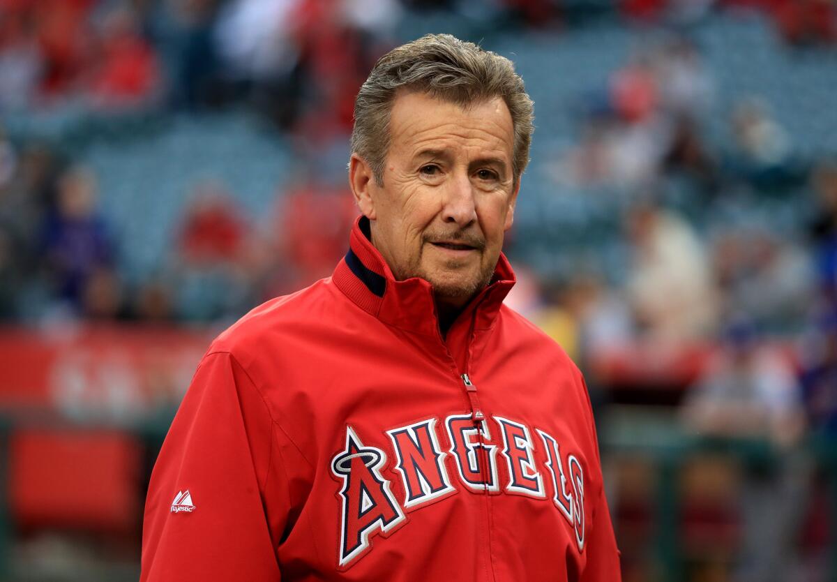Angels owner Arte Moreno walks off the field before a game against Texas on April 9.