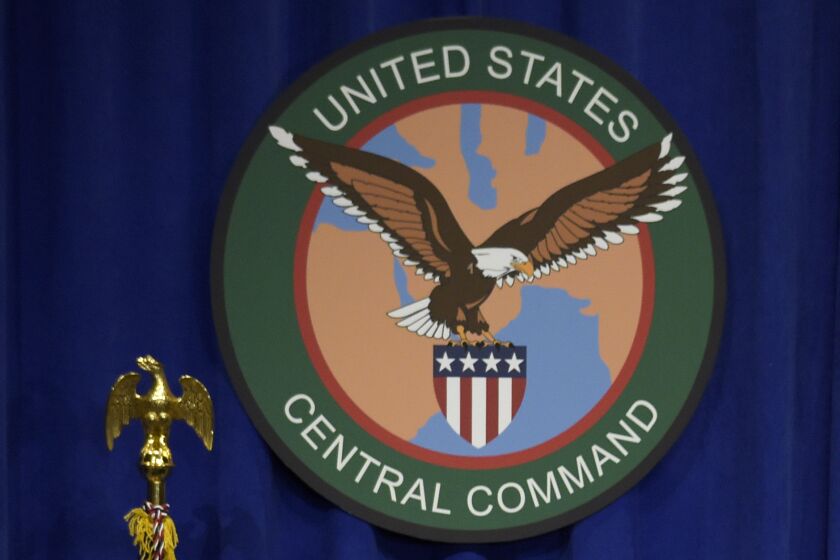 FILE - The seal for the U.S. Central Command is displayed on Feb. 6, 2017, at MacDill Air Force Base in Tampa, Fla. U.S. special operations forces conducted a raid in northeast Syria overnight, killing an Islamic State insurgent who was involved in smuggling weapons and fighters, U.S. officials said Thursday, Oct. 6, 2022. In a statement, U.S. Central Command said the helicopter raid targeted Rakkan Wahid al Shamman, who was known to facilitate the smuggling in support of IS operations. (AP Photo/Susan Walsh, File)