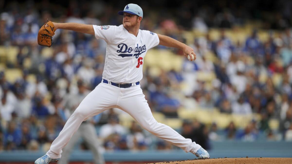 Dodgers pitcher Caleb Ferguson delivers a pitch in the first inning against the Giants at Dodger Stadium.