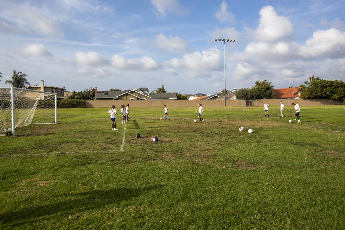 An AYSO Region 56 U14 girls' extra team practices on the soccer fields at the site of the former Gisler Middle School.