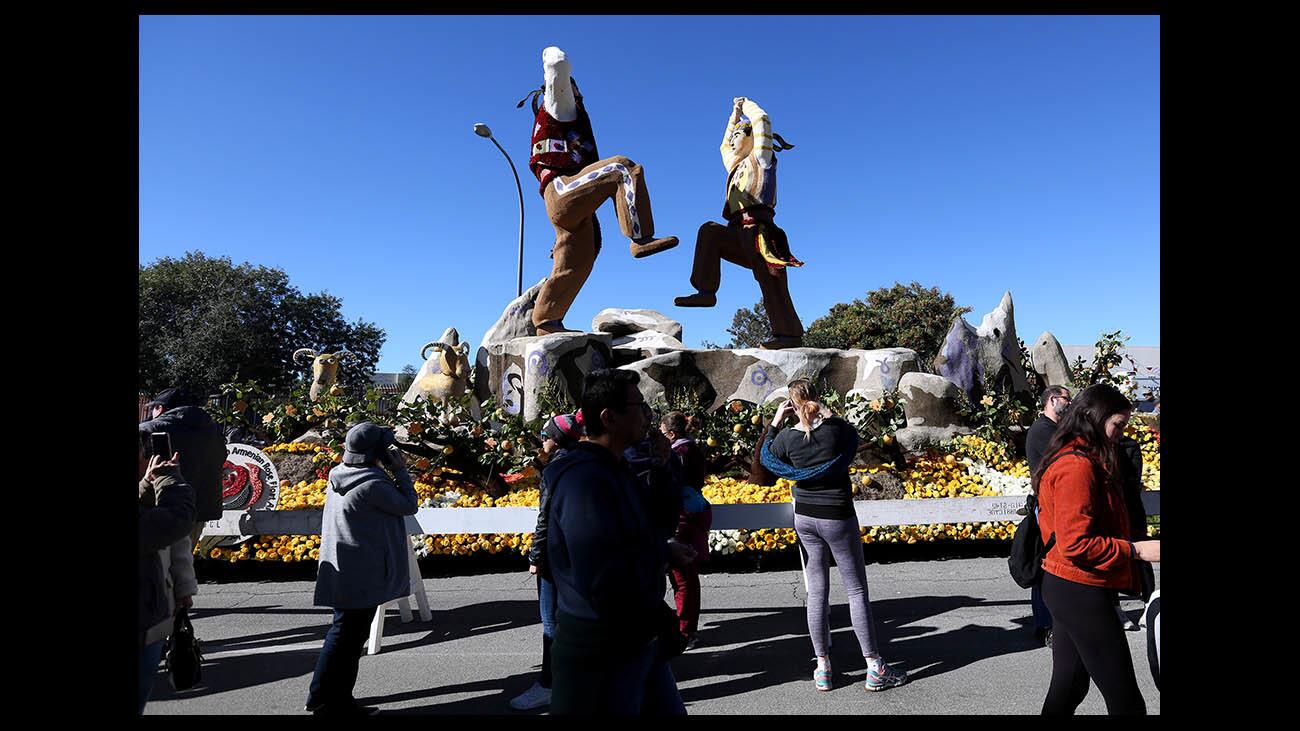 Large crowds came out to view the Tournament of Roses Rose Parade floats, including the American Armenian Rose Float Association float, Chanting Stones: Karahunj, parked on Sierra Madre Blvd, in Pasadena on Wednesday, Jan. 2, 2019.