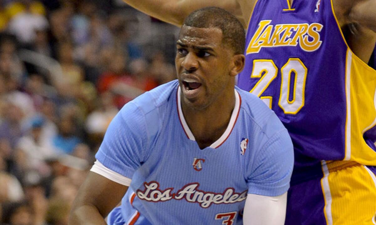 Clippers point guard Chris Paul looks to pass during the first half of the Clippers' 120-97 win over the Lakers on Sunday. Despite playing a leading role in arguably the greatest period in Clippers franchise history, Paul is still drawing plenty of boos from Los Angeles sports fans.