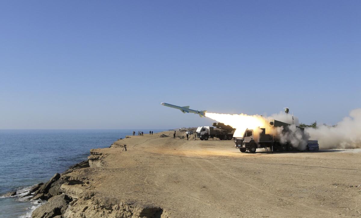 A missile is launched on the shore of the Gulf of Oman during an Iranian navy drill near the port of Jask in 2013.