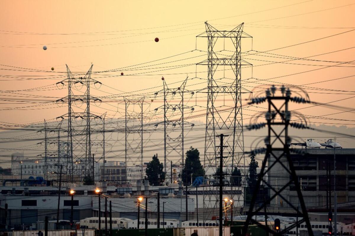 A web of power lines near downtown Los Angeles during the region's searing heat wave. Record electricity demands left a few thousand Southern Californians in the heat and the dark.
