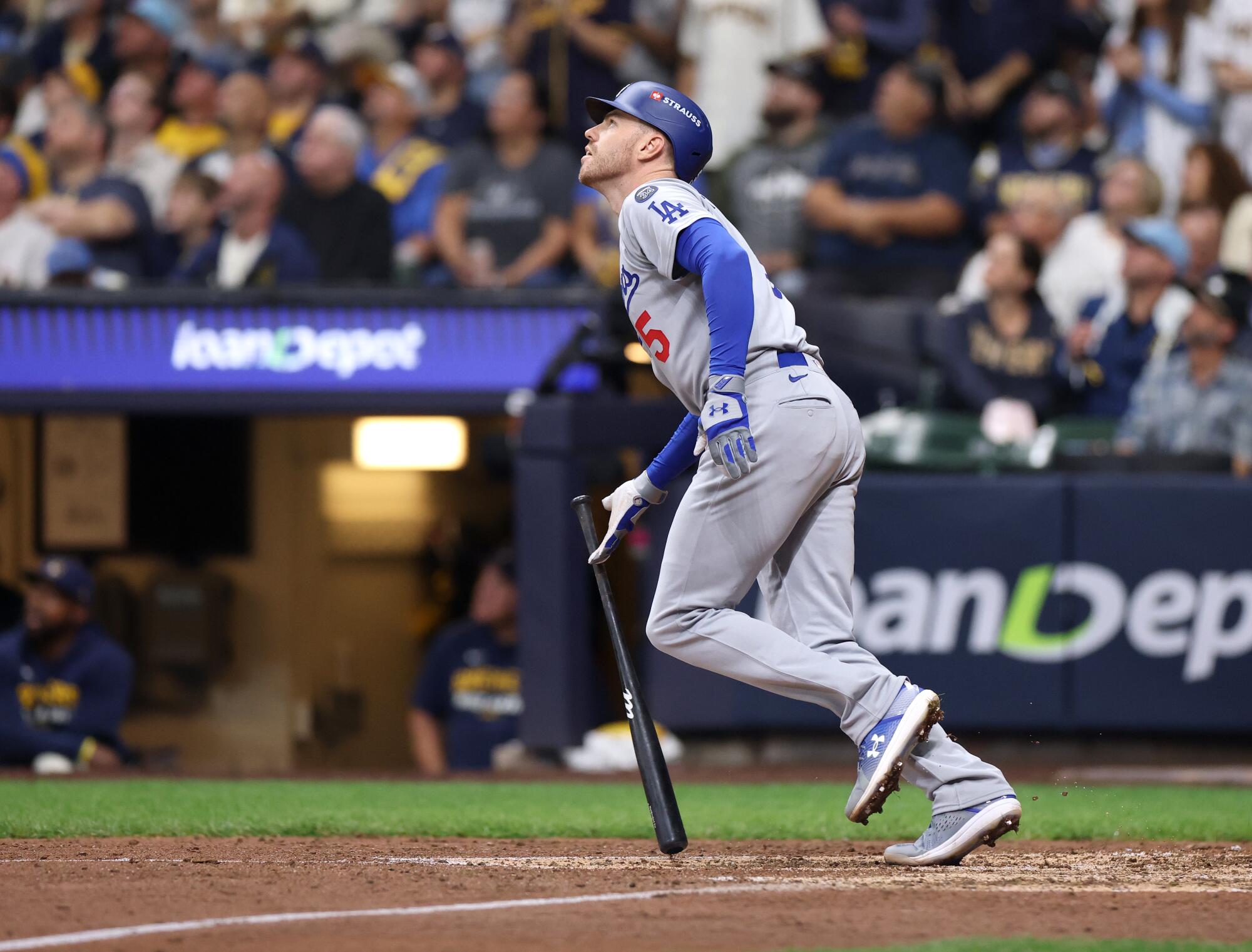 Freddie Freeman hits a solo home run in the sixth inning for the Dodgers in Game 1 of the NLCS.