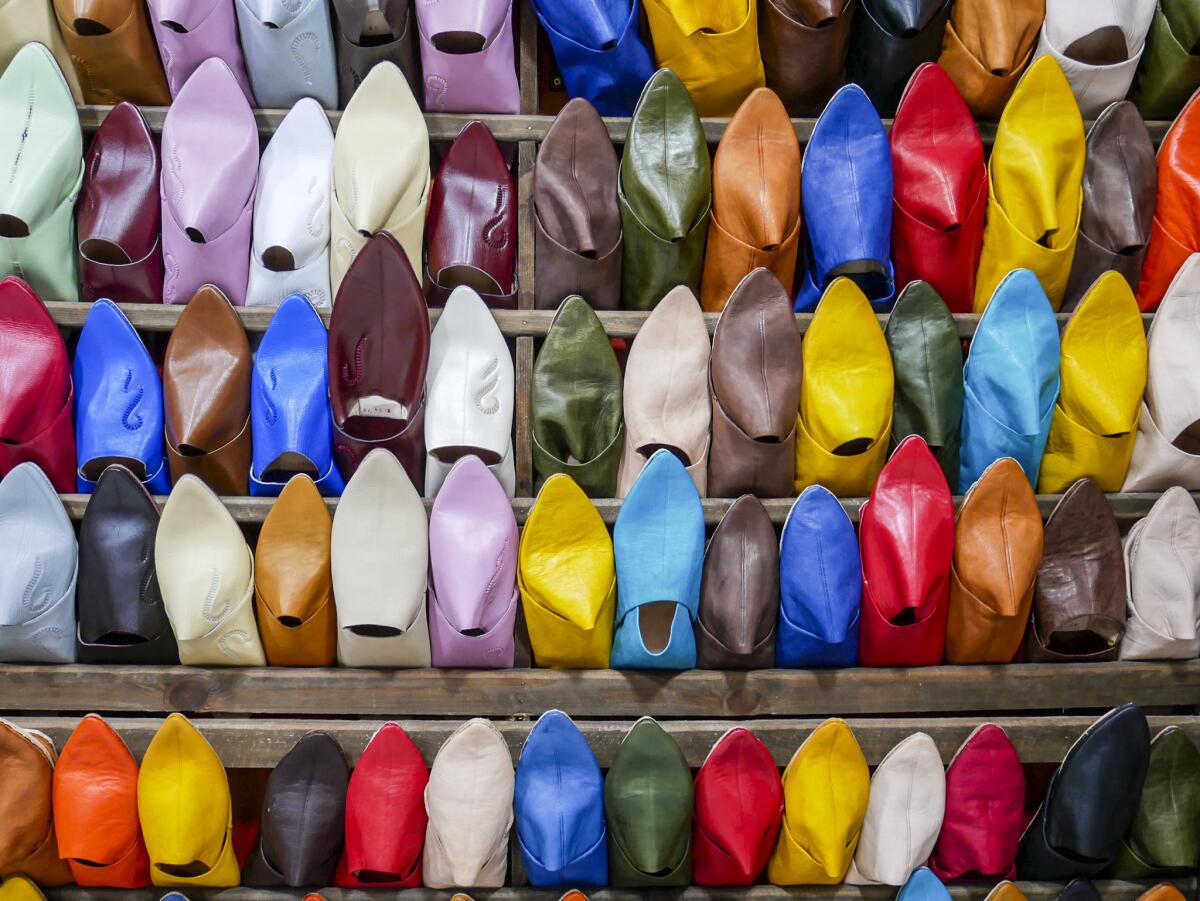 A stall specializes in selling colorful slippers called babouches in the ancient walled city in Fez.