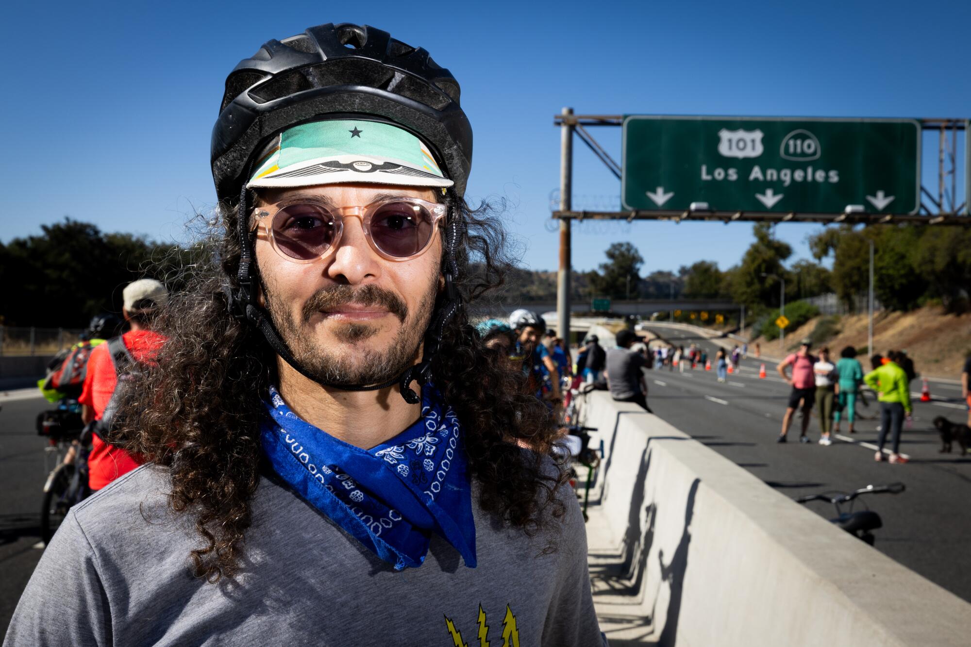 Lawrence Sanchez, of Highland Park, takes a break in the middle of the 110 Freeway.