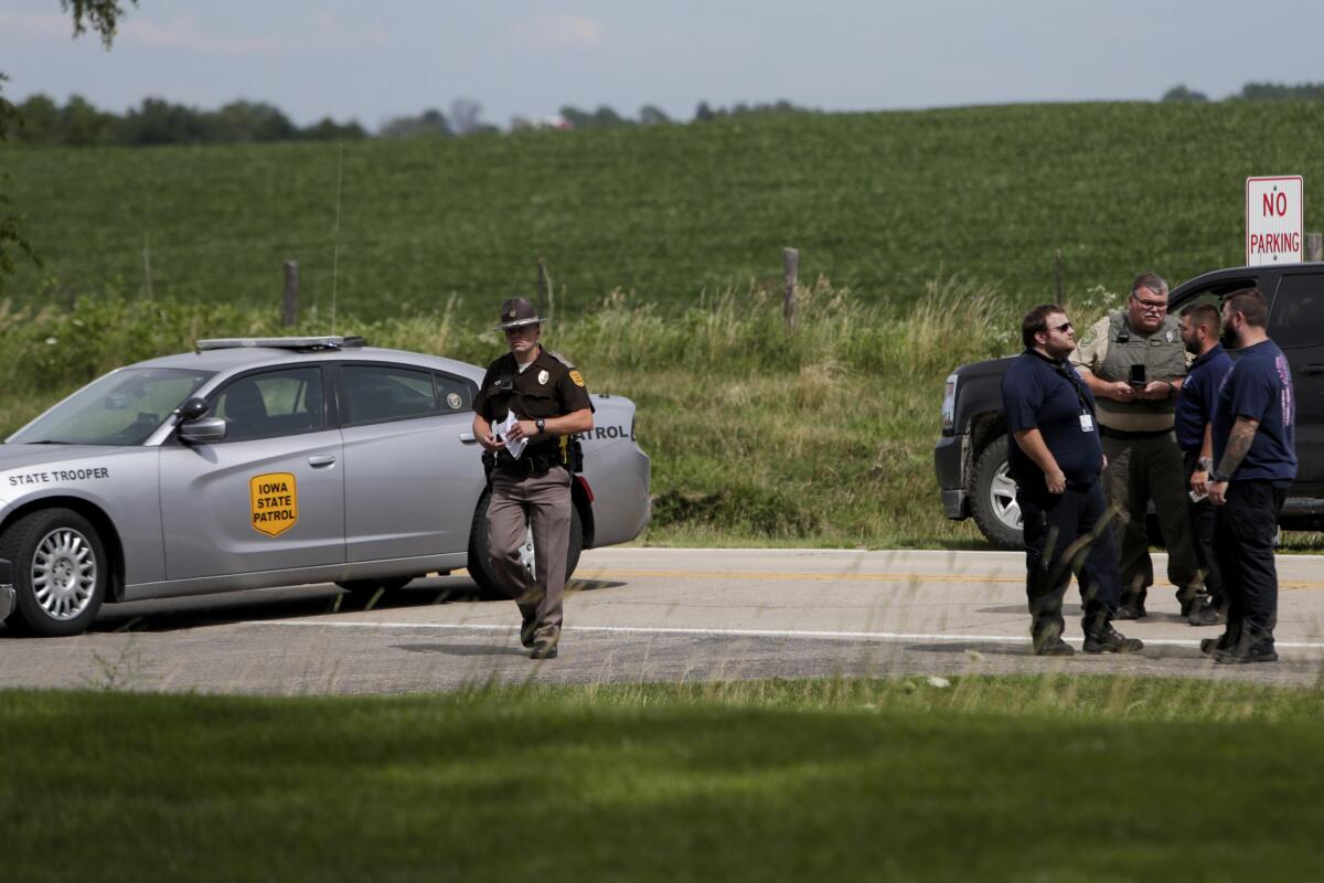 Emergency personnel block an entrance to the Maquoketa Caves State Park as investigate a shooting that left several people dead, Friday, July 22, 2022, in Maquoketa, Iowa. The campground was evacuated in the wake of the shooting. (Nikos Frazier/Quad City Times via AP)