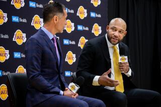 El Segundo, CA - June 06: New Los Angeles Lakers head coach Darvin Ham, right, speaks to the media along with Lakers general manager Rob Pelinka, at the UCLA Health Training Center, in El Segundo, CA, Monday, June 6, 2022. (Jay L. Clendenin / Los Angeles Times)