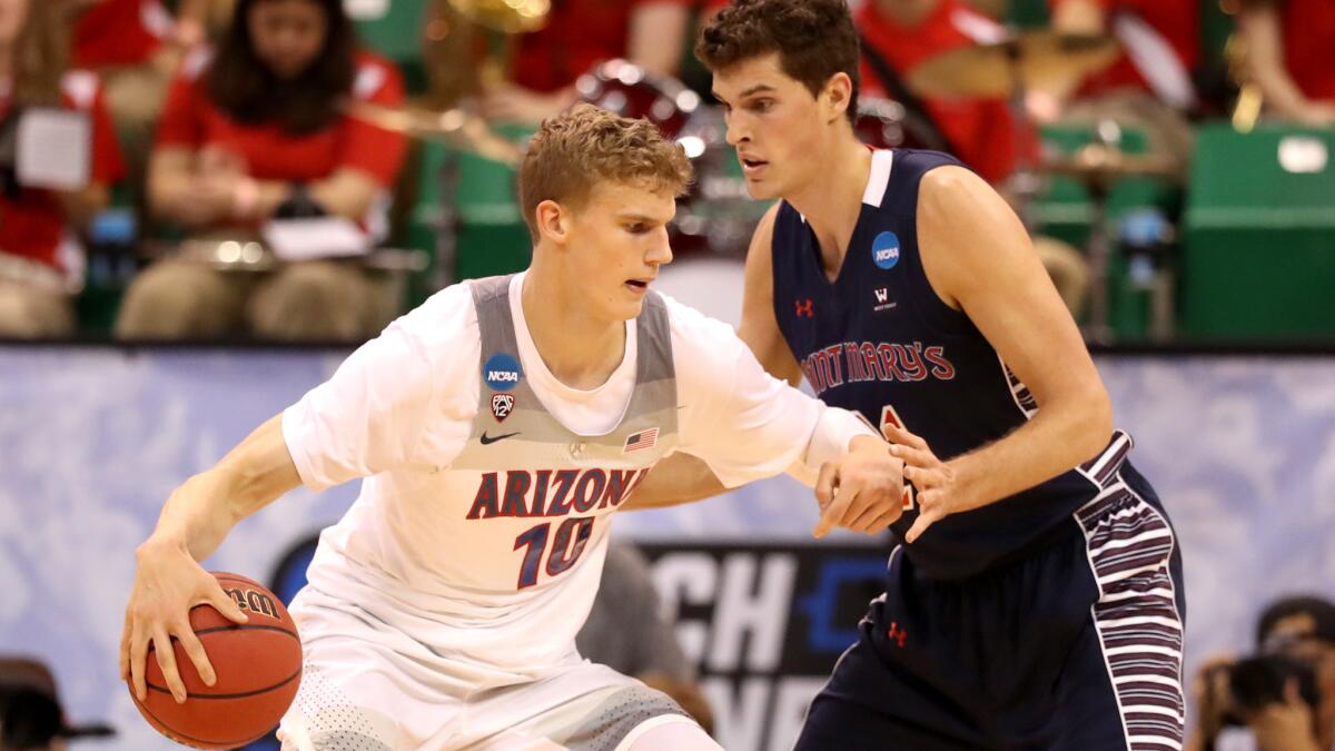 Arizona forward Lauri Markkanen works in the post against St. Mary's center Evan Fitzner during the first half Saturday.