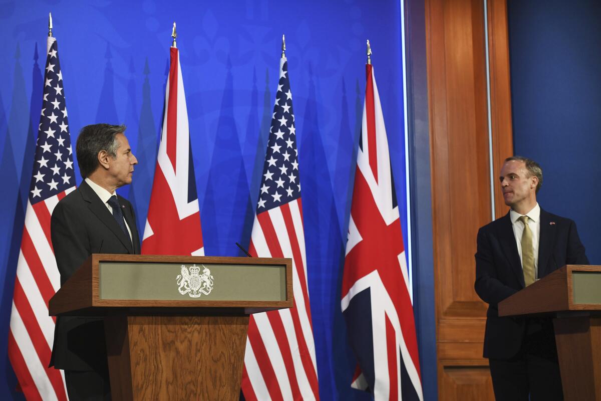 In this May 3, 2021, photo, Britain's Foreign Secretary Dominic Raab, right, and U.S. Secretary of State Antony Blinken speak at a news conference at Downing Street in London. A flurry of diplomatic activity and reports of major progress suggest that indirect talks between the U.S. and Iran may be nearing a conclusion. That's despite efforts by U.S. officials to play down chances of an imminent deal that would bring Washington and Tehran back into compliance with the 2015 nuclear deal. (Chris J. Ratcliffe/Pool Photo via AP)