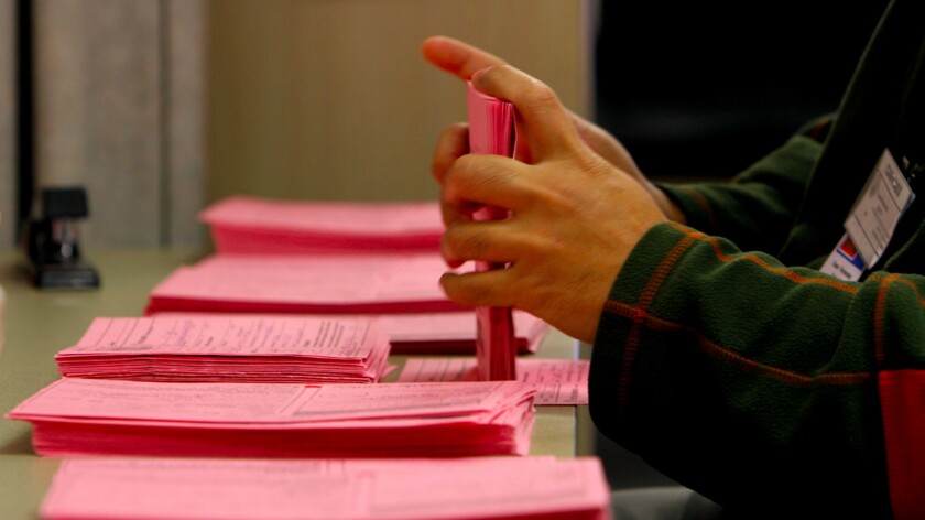 A worker with serialized provisional envelopes at the County Registrar Recorder's Offices in Norwalk, CA November 20, 2012.