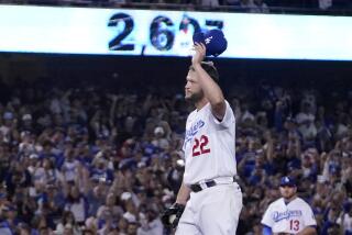 Los Angeles Dodgers starting pitcher Clayton Kershaw acknowledges the crowd after striking.