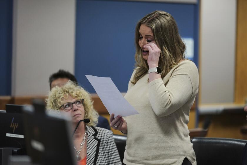 Jenna Ellis reads a statement after Ellis plead guilty to a felony count of aiding and abetting false statements and writings, inside Fulton Superior Court Judge Scott McAfee's Fulton County Courtroom, Tuesday, Oct. 24, 2023, in Atlanta. Ellis, an attorney and prominent conservative media figure, reached a deal with prosecutors Tuesday, Oct. 24, 2023, and pleaded guilty to a reduced charge over efforts to overturn Donald Trump's 2020 election loss in Georgia. (AP Photo/John Bazemore, Pool)