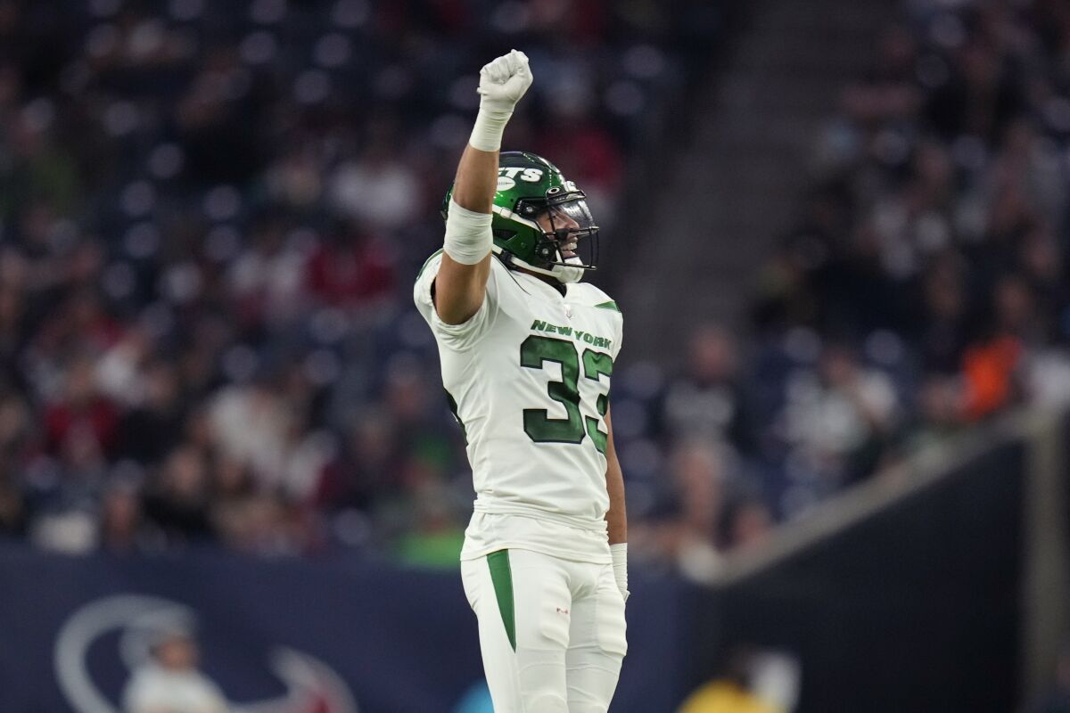 New York Jets safety Elijah Riley (33) celebrates after a tackle in the second half of an NFL football game against the Houston Texans in Houston, Sunday, Nov. 28, 2021. The Jets won 21-14. (AP Photo/Eric Smith)
