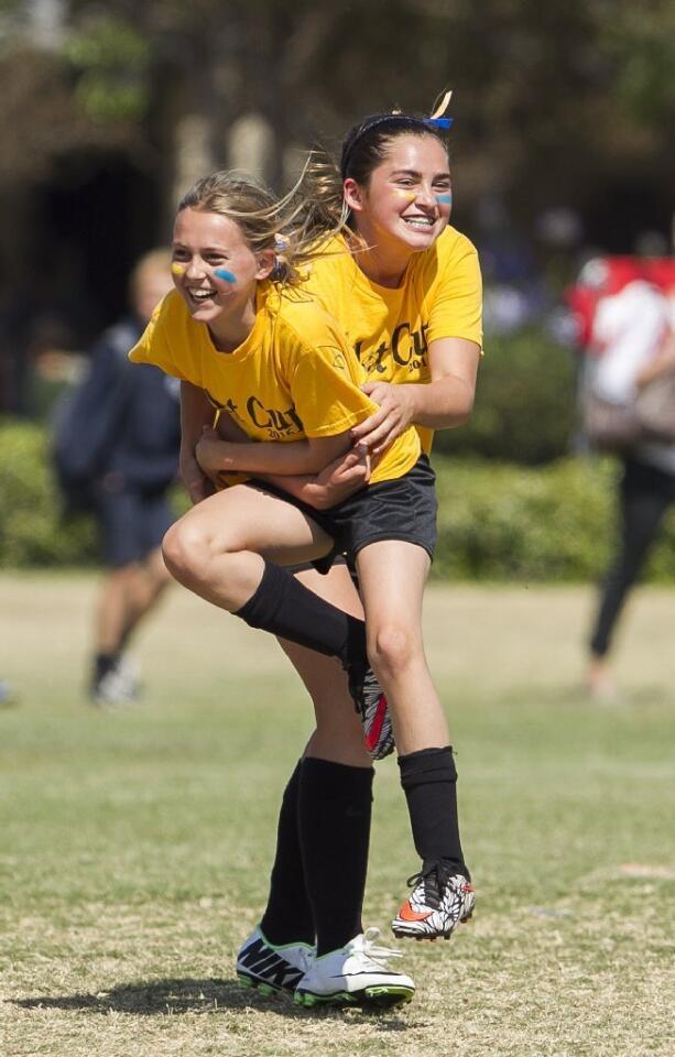 Harbor Day's Claire Eusey celebrates with Christi Francois after Froncois scored a goal against Pegasus during a girls' 5-6 Gold Division game on Thursday.