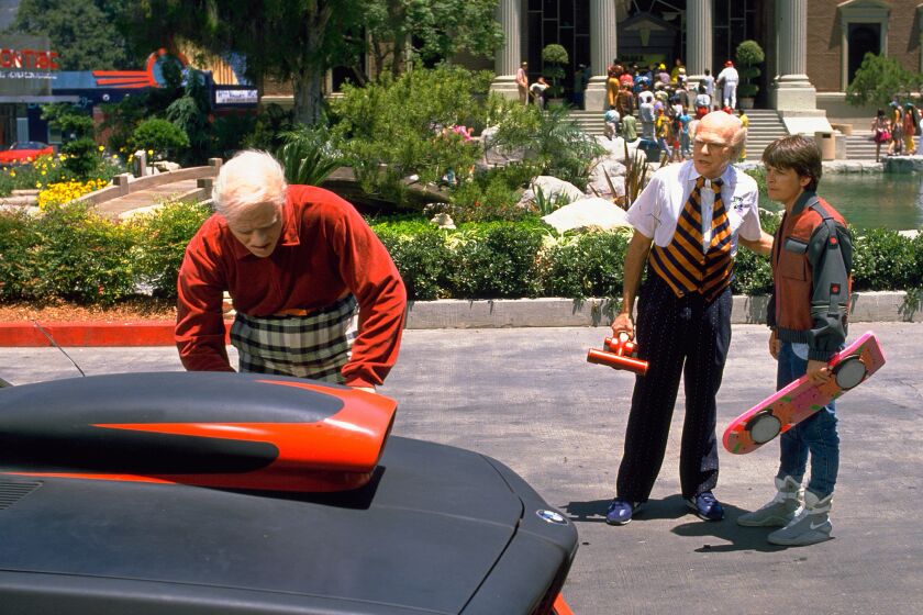 Michael J. Fox, right, appears in the 2015 depicted in "Back to the Future II."