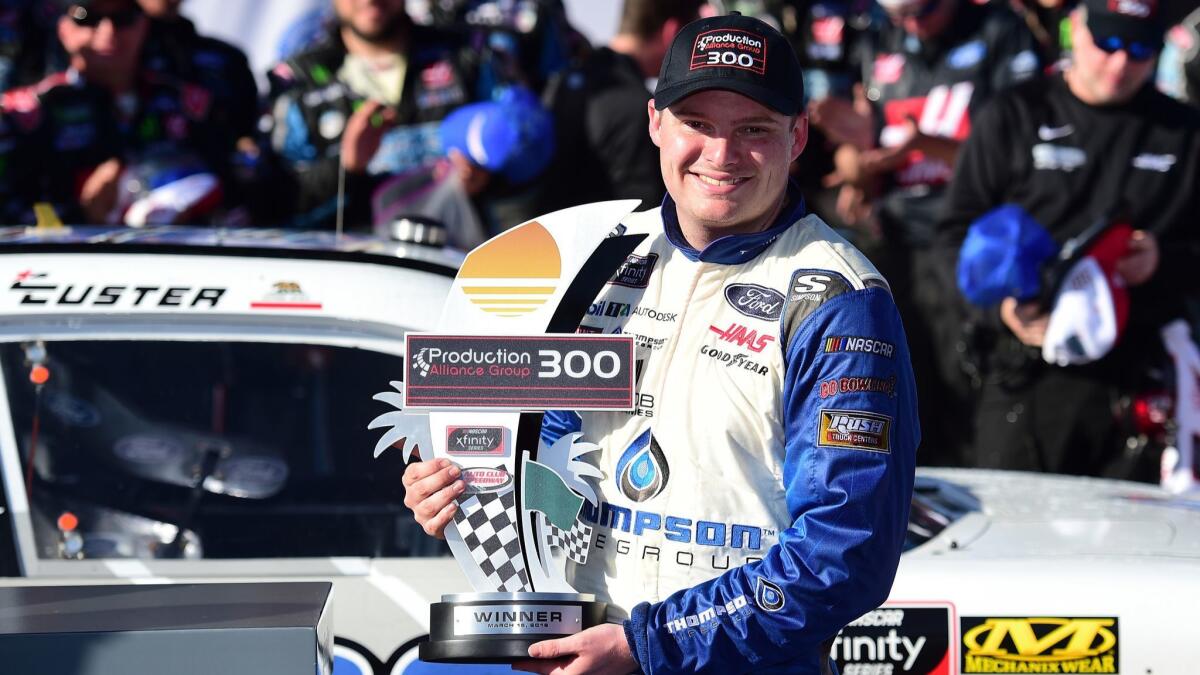 Cole Custer basks in the limelight on Victory Lane after winning the NASCAR Xfinity Series Production Alliance Group 300 at Auto Club Speedway in Fontana on Saturday.