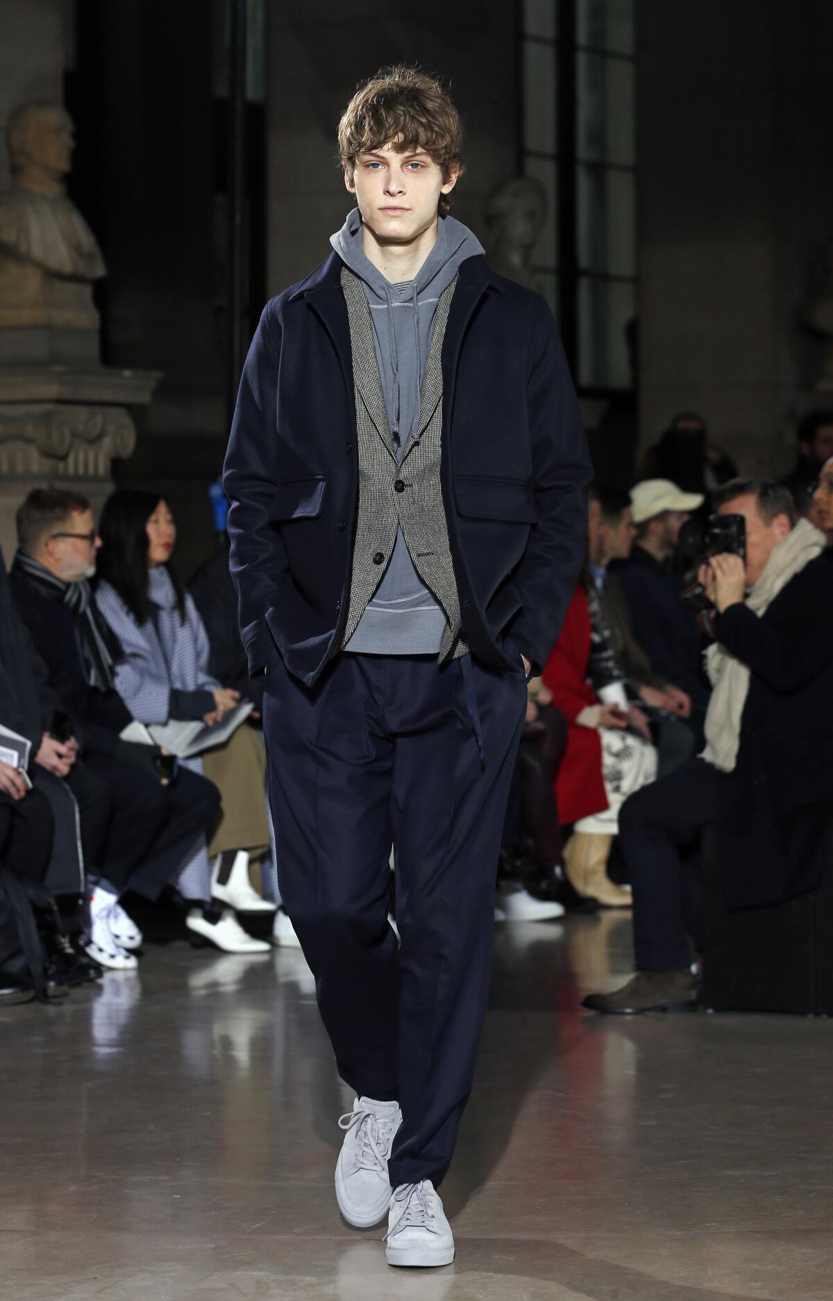 Some designers are incorporating the laid-back look of streetwear into their suits, like this runway outfit by Pierre Maheo of Officine Generale.