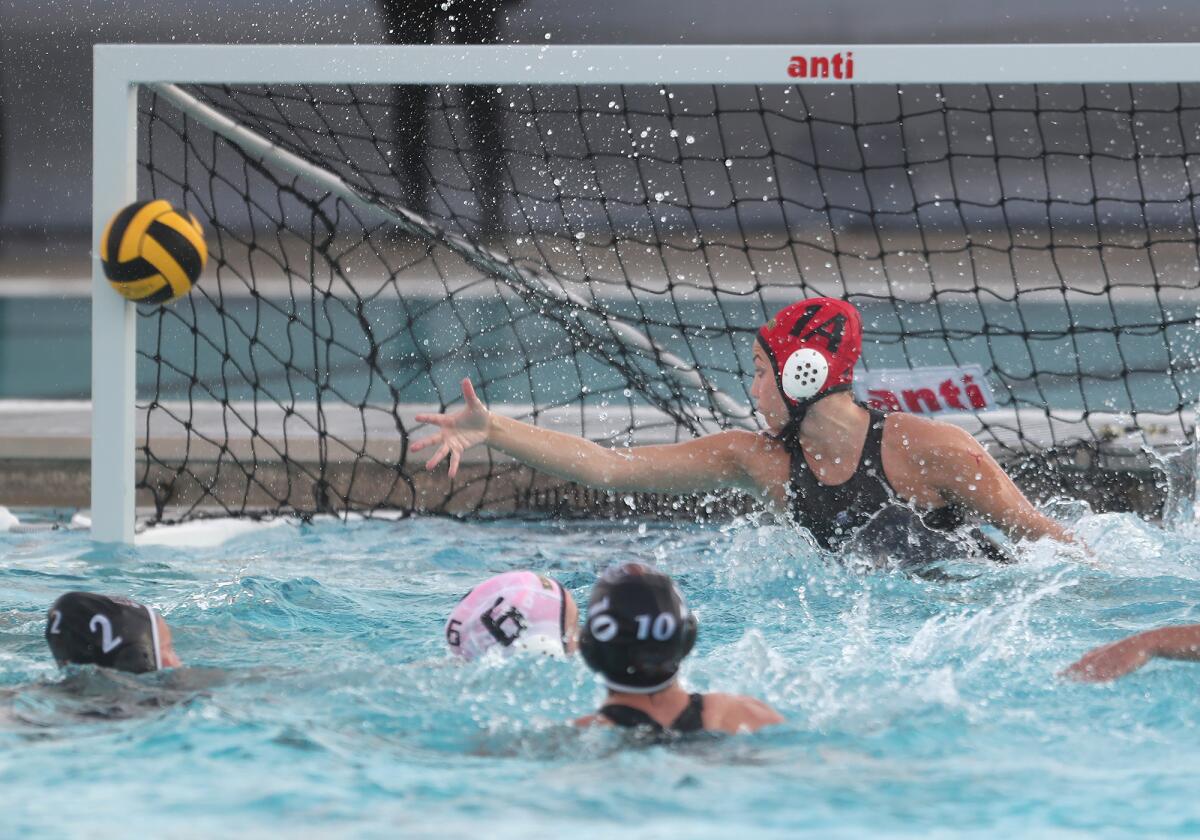 Edison's goalie Madilyn Ambrose (1A) deflects a shot.