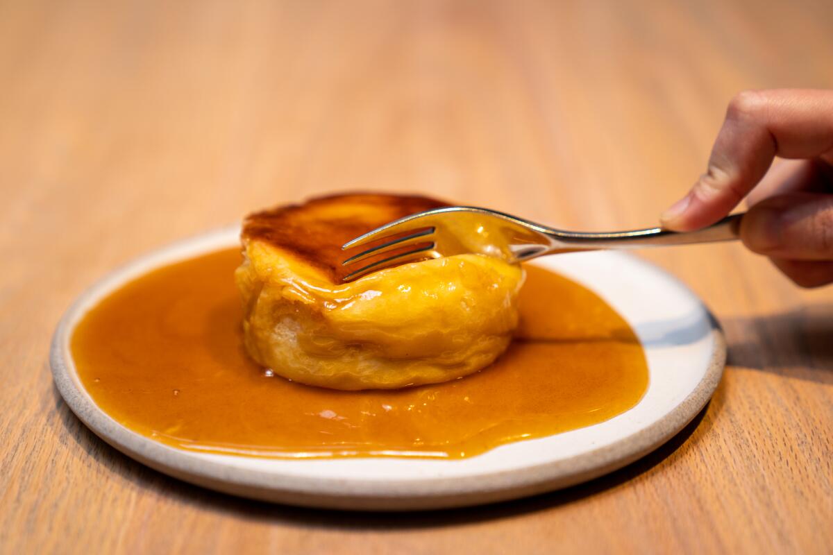 LOS ANGELES, CA - MARCH 14: Pastry Chef Dyan Ng makes a pan roasted honey butter Brioche in the kitchen at Aubur