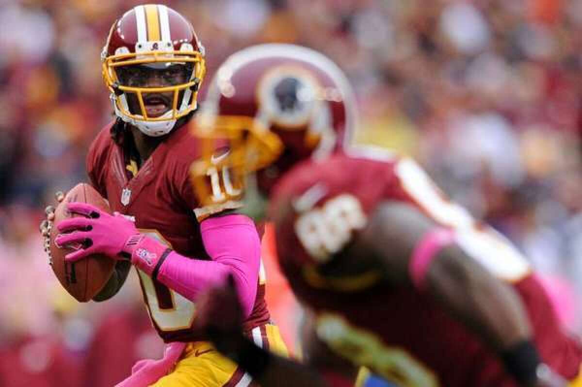 Will DirecTV pass on Sunday Ticket? Above, Redskins quarterback Robert Griffin III.