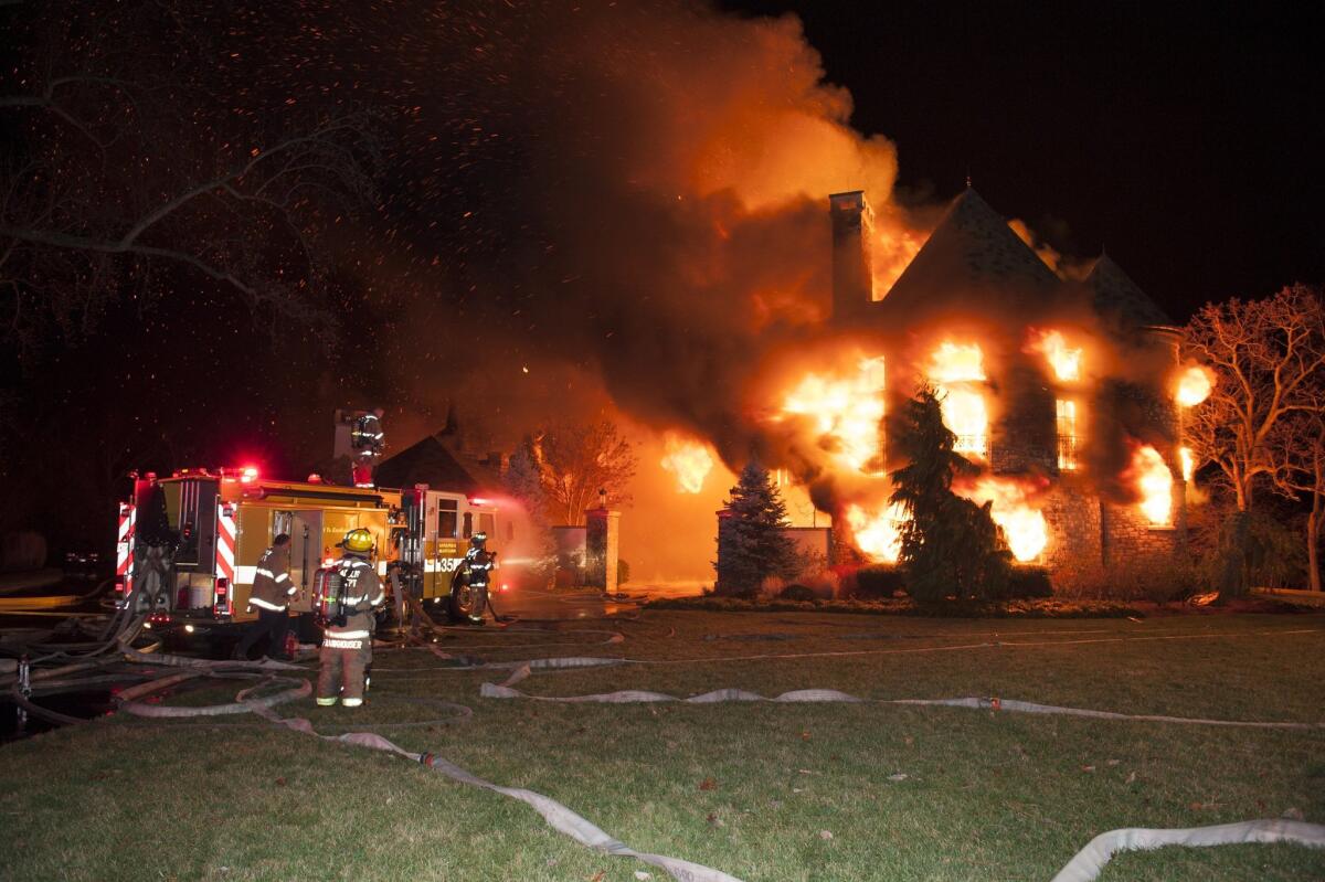 Firefighters battle a blaze at a home outside Annapolis, Md., early Monday.
