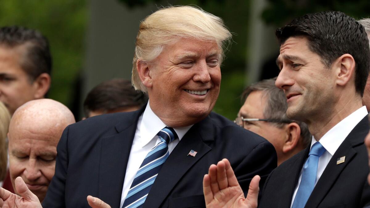 No laughing matter for millions of Americans: President Trump and House Speaker Paul Ryan share a warm moment on May 4, after the House GOP passed a bill to repeal the Affordable Care Act.