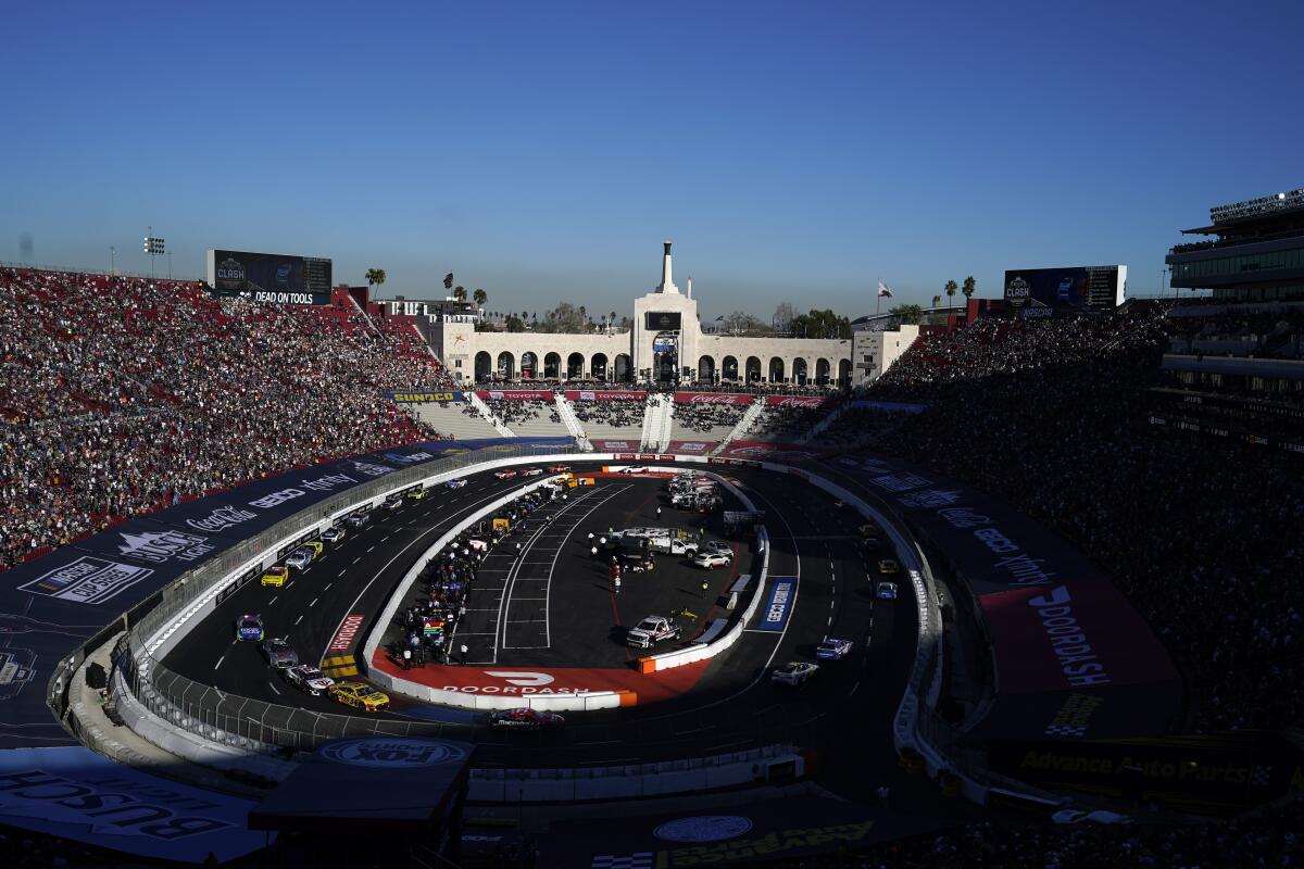 Competitors make a turn during the NASCAR Clash race at the Los Angeles Memorial Coliseum.