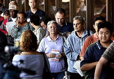 Voters stand in line outside the Los Angeles County Registrar and Records office in Norwalk. Sixteen touch screens were set up in a narrow winding hallway on the third floor of the L.A. County building.