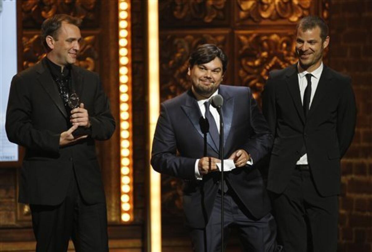 From left, Trey Parker, Robert Lopez and Matt Stone accept the award for Best Book of a Musical for "The Book of Mormon" during the 65th annual Tony Awards, Sunday, June 12, 2011 in New York. (AP Photo/Jeff Christensen).. — AP