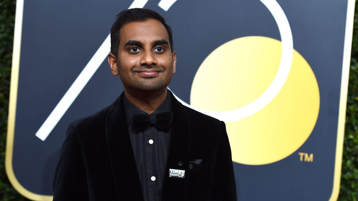 Actor Aziz Ansari, the subject of a recent allegations of sexual impropriety, wears a "Time's Up" pin at the Golden Globe Awards in Beverly Hills on Jan. 7.