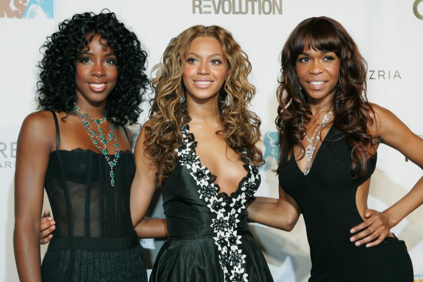 FILE - Kelly Rowland, left, Beyonce Knowles, center, and Michelle Williams of Destiny's Child appear at the second annual Fashion Rocks concert in New York on Sept. 8, 2005. Rocker Stevie Nicks, who is releasing a concert film “Stevie Nicks 24 Karat Gold The Concert” later this month, let the R&B girl group Destiny’s Child sample the song “Edge of Seventeen" for their 2001 smash “Bootylicious.” Nicks even appeared in the video, and remembers meeting Kelly Rowland, Michelle Williams and Beyoncé — who was just 19 at the time. (AP Photo/Diane Bondareff, File)