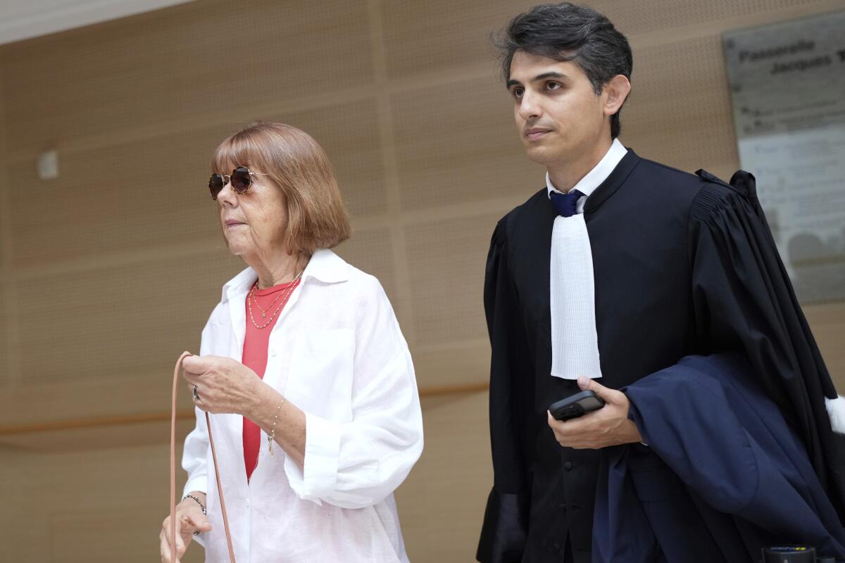 Gisele Pelicot, left, arrives in the Avignon court house, in Avignon, southern France.