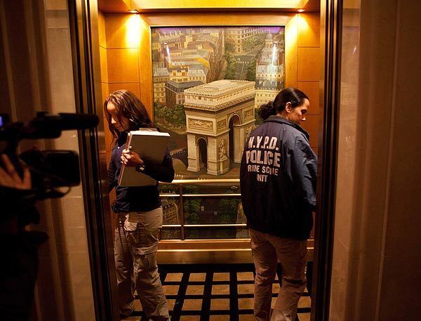 Two members of the NYPD crime scene unit enter an elevator at the Sofitel hotel in New York to investigate the assault case.