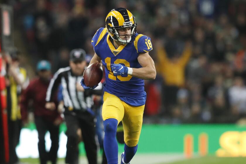 BRams wide receiver Cooper Kupp runs down the sideline after making a reception on a double-reverse pass.