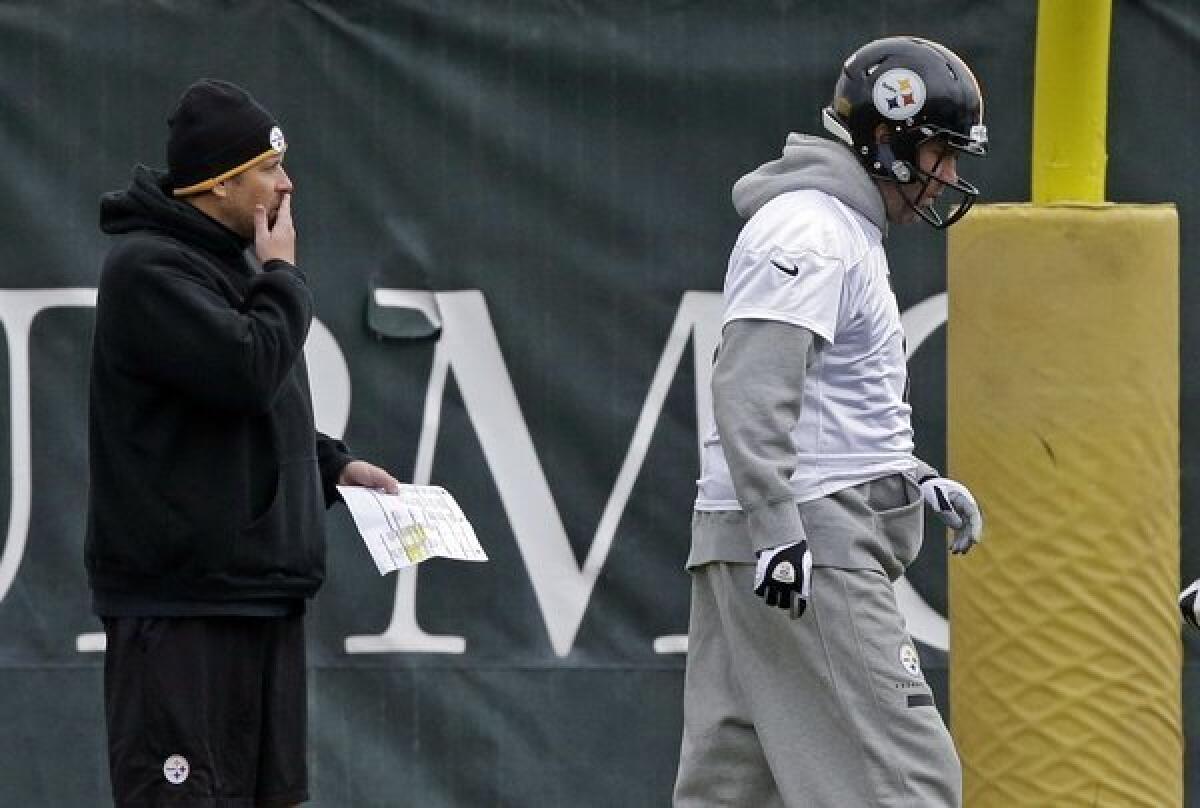 Pittsburgh Steelers offensive coordinator Todd Haley, left, and quarterback Benn Roethlisberger at practice Wednesday. Roethlisberger blamed his blunt comments after Sunday's loss to Dallas on frustration.