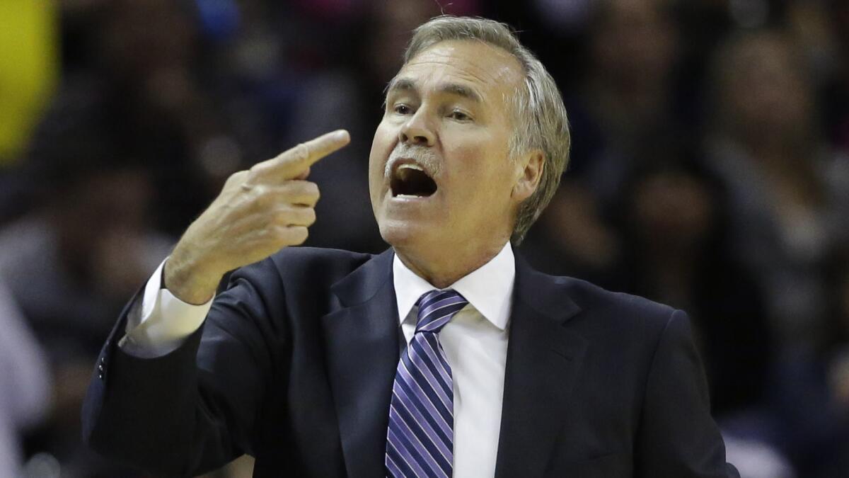 Lakers Coach Mike D'Antoni directs the Lakers during game against the Spurs in San Antonio.