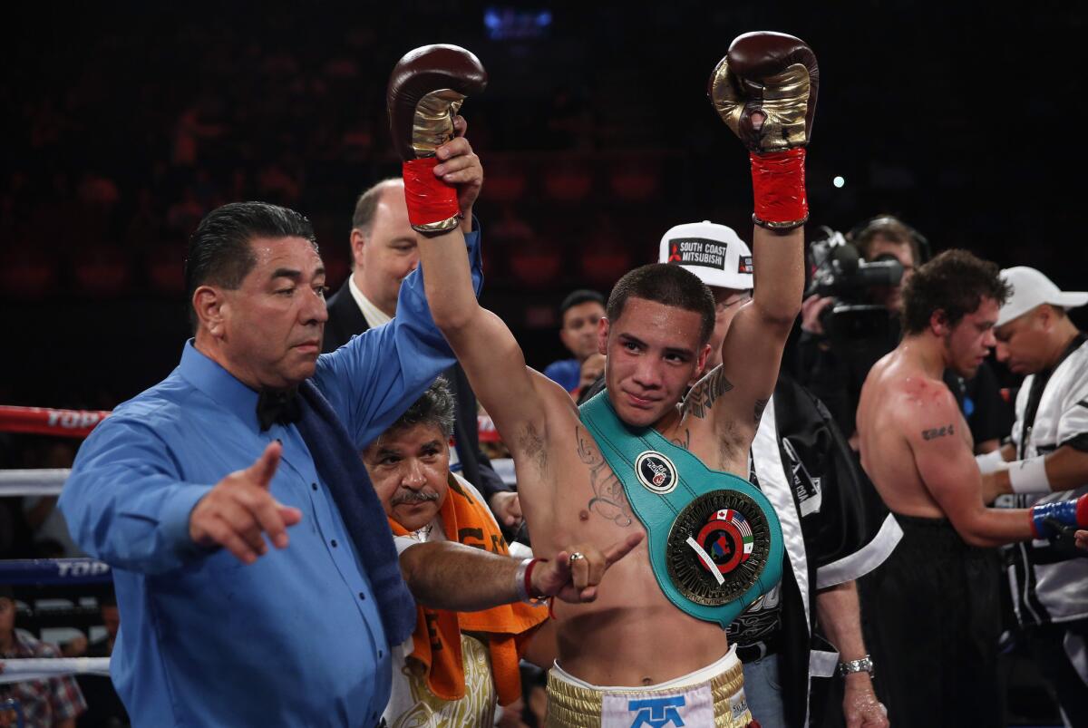 Oscar Valdez celebrates his victory over Noel Echevarria at the Forum on May 17, 2014.