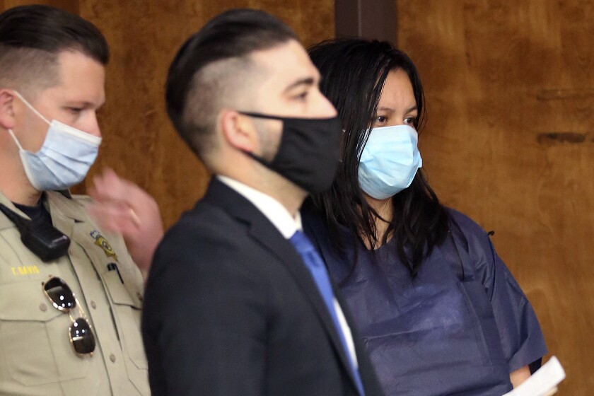 Liliana Carillo, right, appears with her representative, Deputy Public Defender Brandon Mata, during her arraignment in Kern County Superior Court on Wednesday April 14, 2021, in Bakersfield, Calif. Carillo, suspected of killing her three young children in Los Angeles, has been transferred to the Kern County Jail on suspicion of felony auto theft and carjacking. She is being held with a $2 million bail. The Los Angeles Police Department is leading the investigation into the deaths of the children. (Alex Horvath/The Bakersfield Californian via AP)