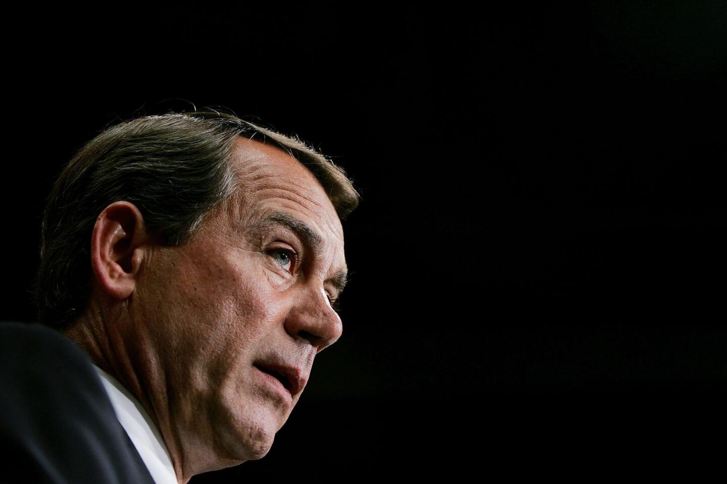 House Majority Leader Rep. John Boehner answers questions during a news conference at the U.S. Capitol in 2006. Boehner plans to step down from his post and leave Congress at the end of October.