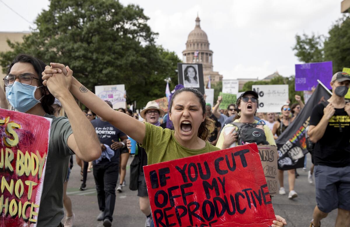 People march in Austin, Texas, to rally for abortion rights