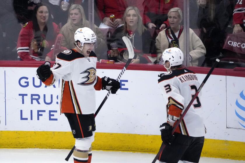 Anaheim Ducks' Frank Vatrano, left, celebrates his game winning goal with John Klingberg (3) during the overtime period of an NHL hockey game against the Chicago Blackhawks Tuesday, Feb. 7, 2023, in Chicago. The Ducks won 3-2. (AP Photo/Charles Rex Arbogast)