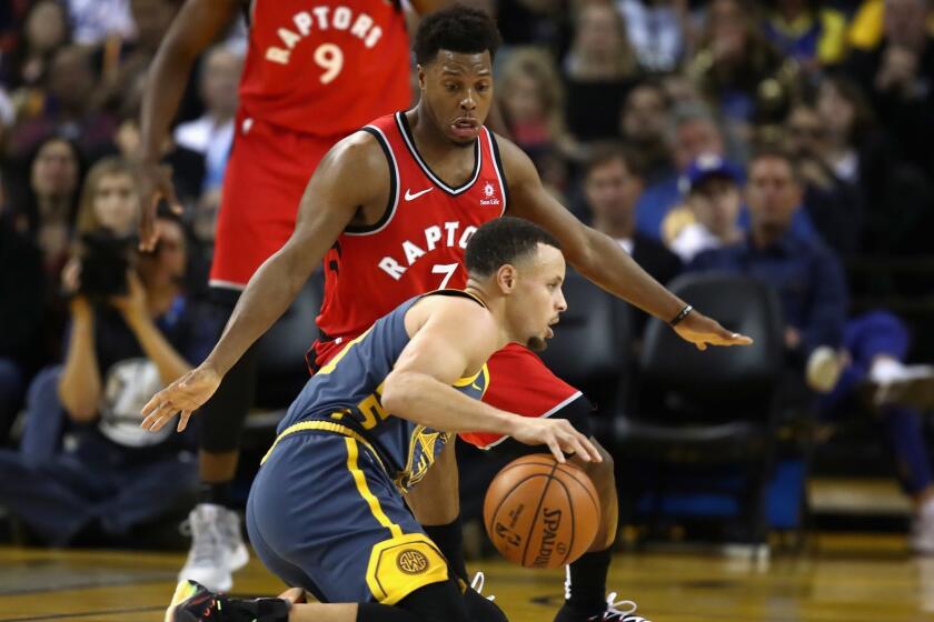 OAKLAND, CA - DECEMBER 12: Stephen Curry #30 of the Golden State Warriors dribbles on his knees while being guarded by Kyle Lowry #7 of the Toronto Raptors at ORACLE Arena on December 12, 2018 in Oakland, California. NOTE TO USER: User expressly acknowledges and agrees that, by downloading and or using this photograph, User is consenting to the terms and conditions of the Getty Images License Agreement. (Photo by Ezra Shaw/Getty Images) ** OUTS - ELSENT, FPG, CM - OUTS * NM, PH, VA if sourced by CT, LA or MoD **