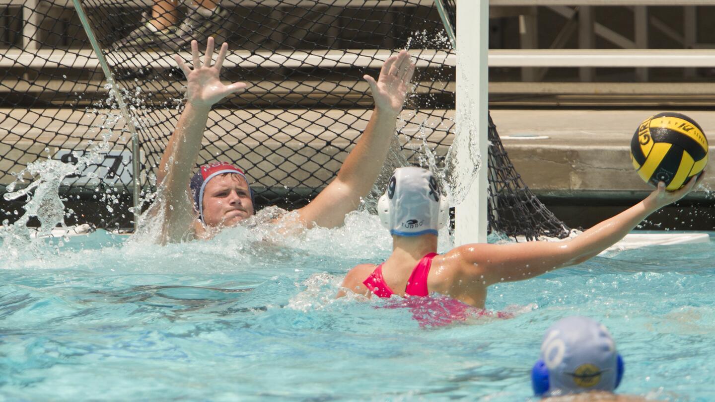 Photo Gallery: Corona del Mar High Girls' Water Polo Team vs. Senior Football players in a water polo game