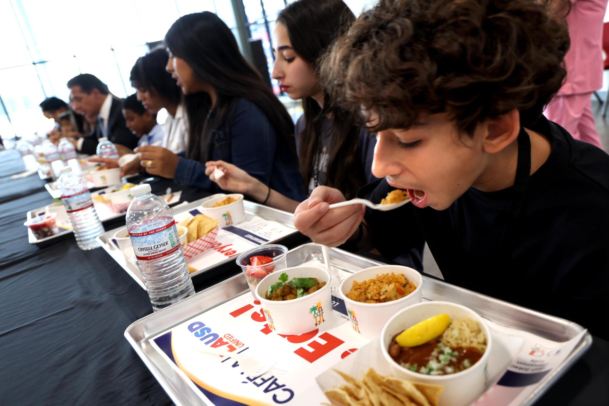 Students sample cafereria food. 