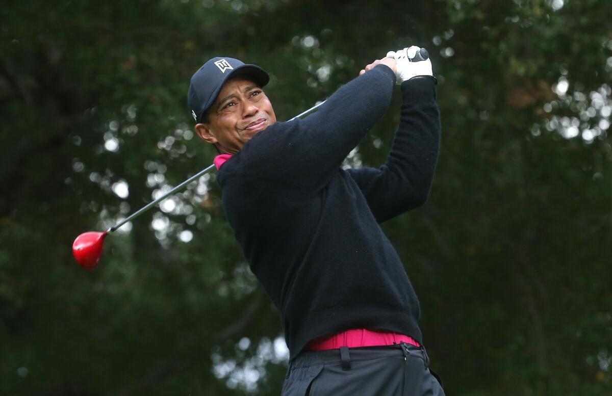 Tiger Woods watches his tee shot on the sixth hole during the second round of the Northwestern Mutual World Challenge at Sherwood Country Club in Thousand Oaks on Friday.