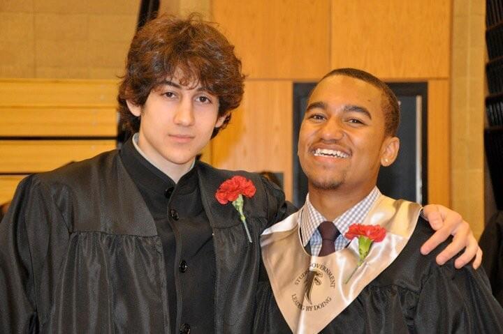 Dzhokhar A. Tsarnaev, left, poses with a friend upon graduating from Cambridge Rindge and Latin High School in Cambridge, Mass. The young man at right is the nephew of Boston radio show host Robin Young. The two have talked about their connection to the suspect on WBUR radio.