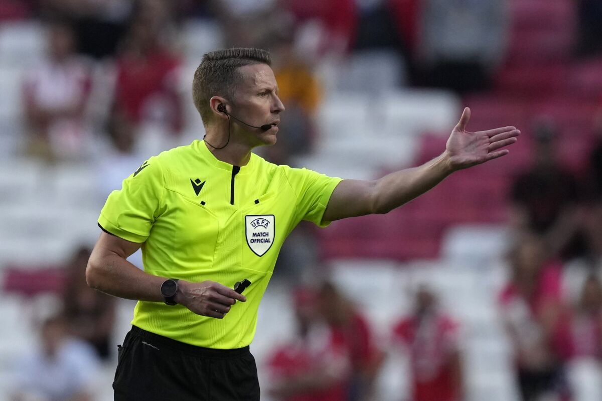 Referee Alejandro Hernаndez gives directions during the Champions League, third qualifying round, first leg soccer match between Benfica and Midtjylland at the Luz stadium in Lisbon, Portugal, Tuesday, Aug. 2, 2022. (AP Photo/Armando Franca)