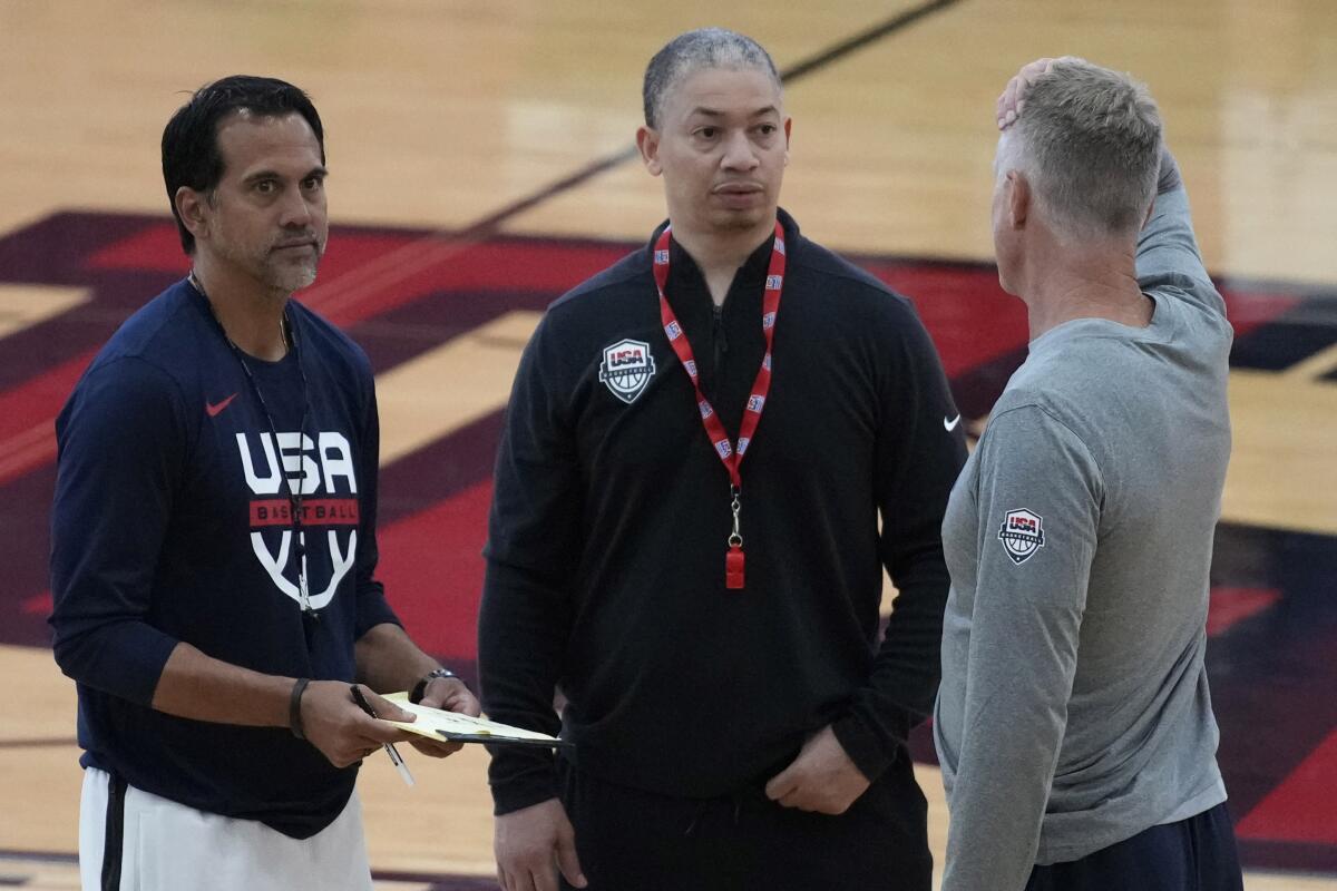 Team USA assistants Tyronn Lue, center, and Erik Spoelstra, left, talk with coach Steve Kerr during a practice in Las Vegas.